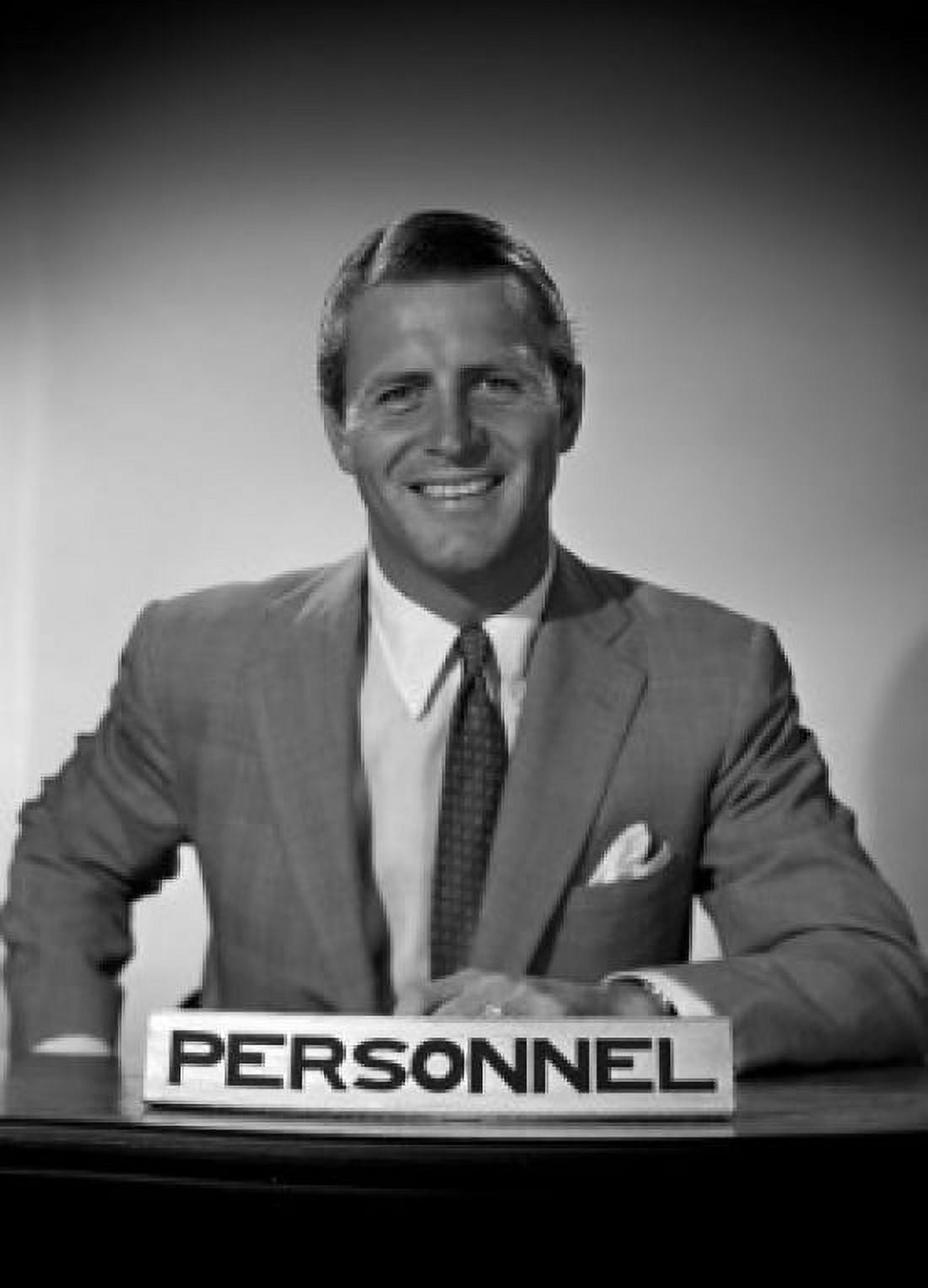 Studio portrait of businessman smiling by personnel sign Canvas Art - (24 x 36)