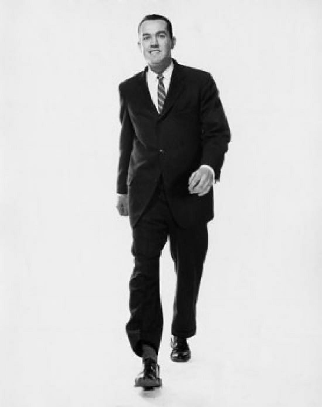 Studio portrait of businessman walking Canvas Art - (18 x 24)