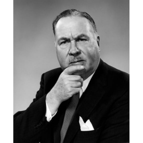 Studio portrait of businessman with hand on chin Poster Print (18 x 24)