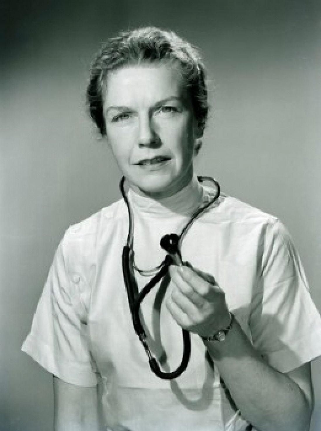 Studio portrait of female doctor holding stethoscope Canvas Art - (24 x 36)