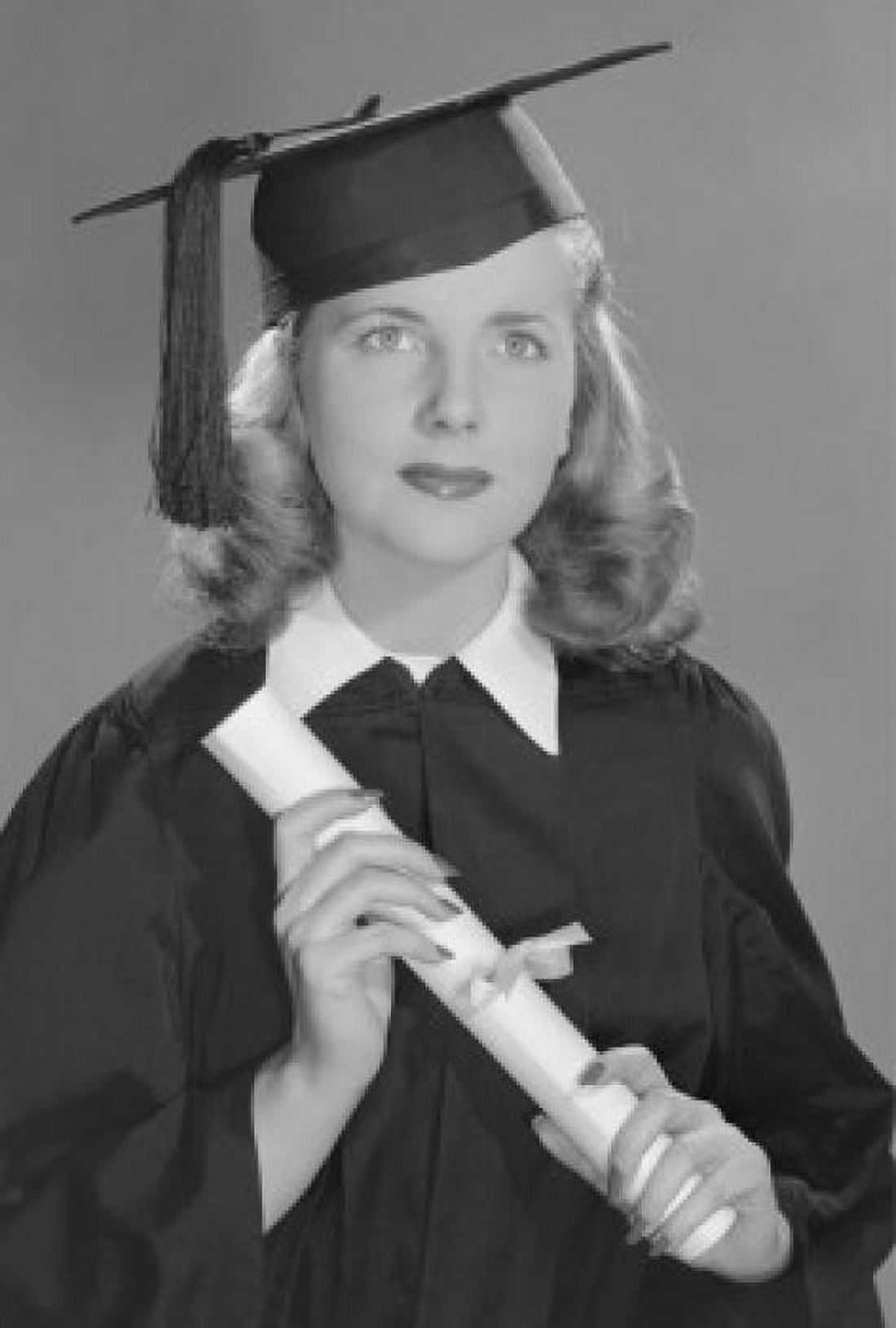 Studio portrait of female graduate holding diploma Canvas Art - (18 x 24)