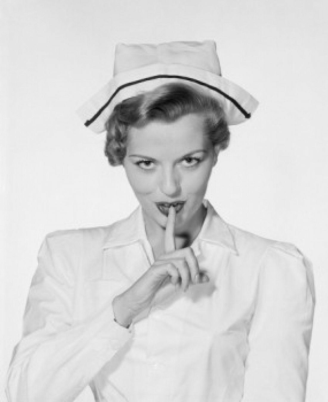 Studio portrait of female nurse gesturing silence Canvas Art -  (24 x 36)