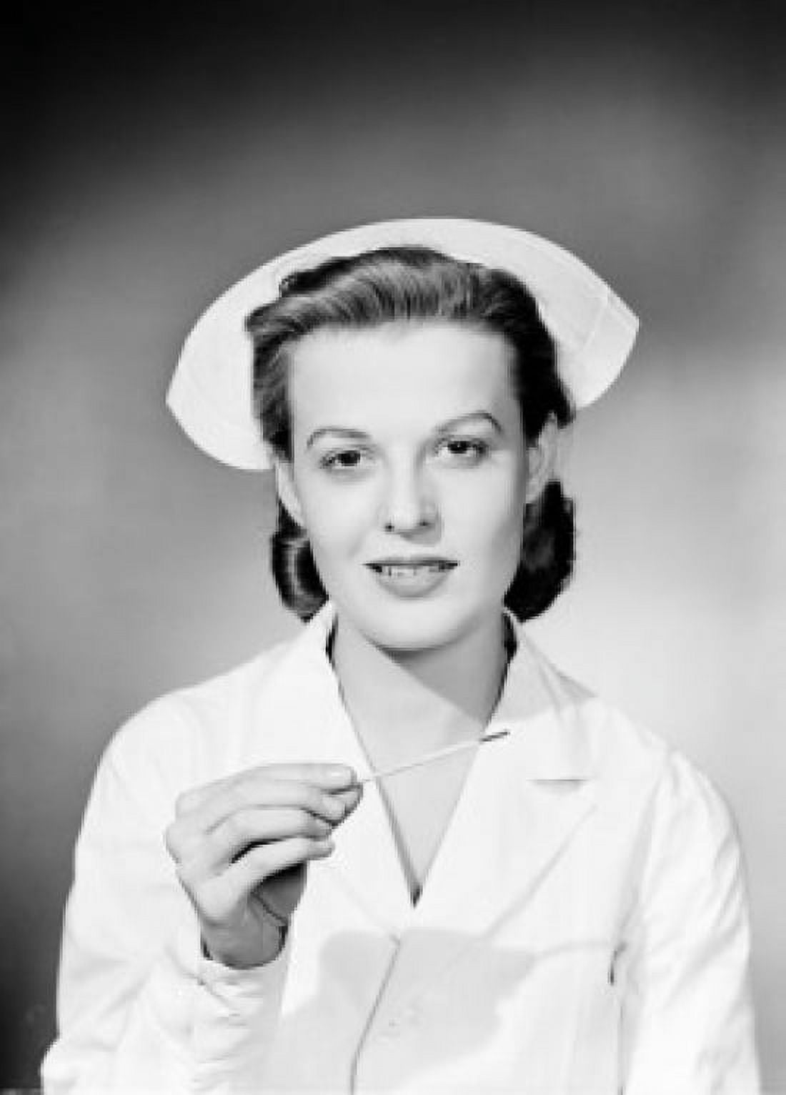 Studio portrait of female nurse holding thermometer Canvas Art - (18 x 24)
