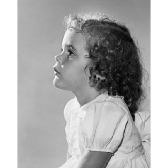 Studio portrait of girl looking up Poster Print (24 x 36)