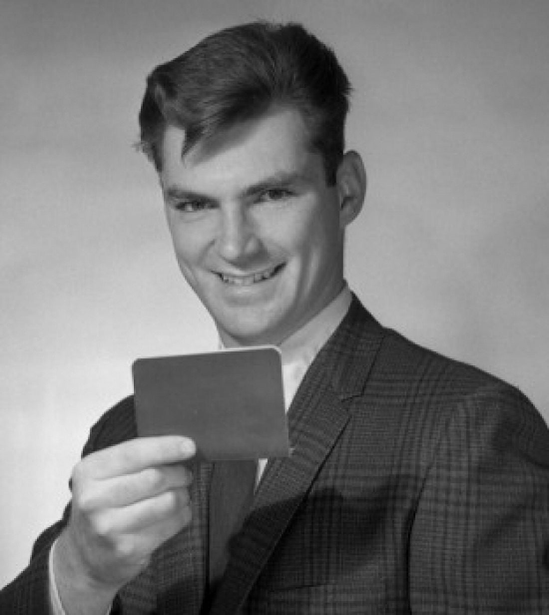 Studio portrait of male customs officer checking passport Canvas Art - (24 x 36)