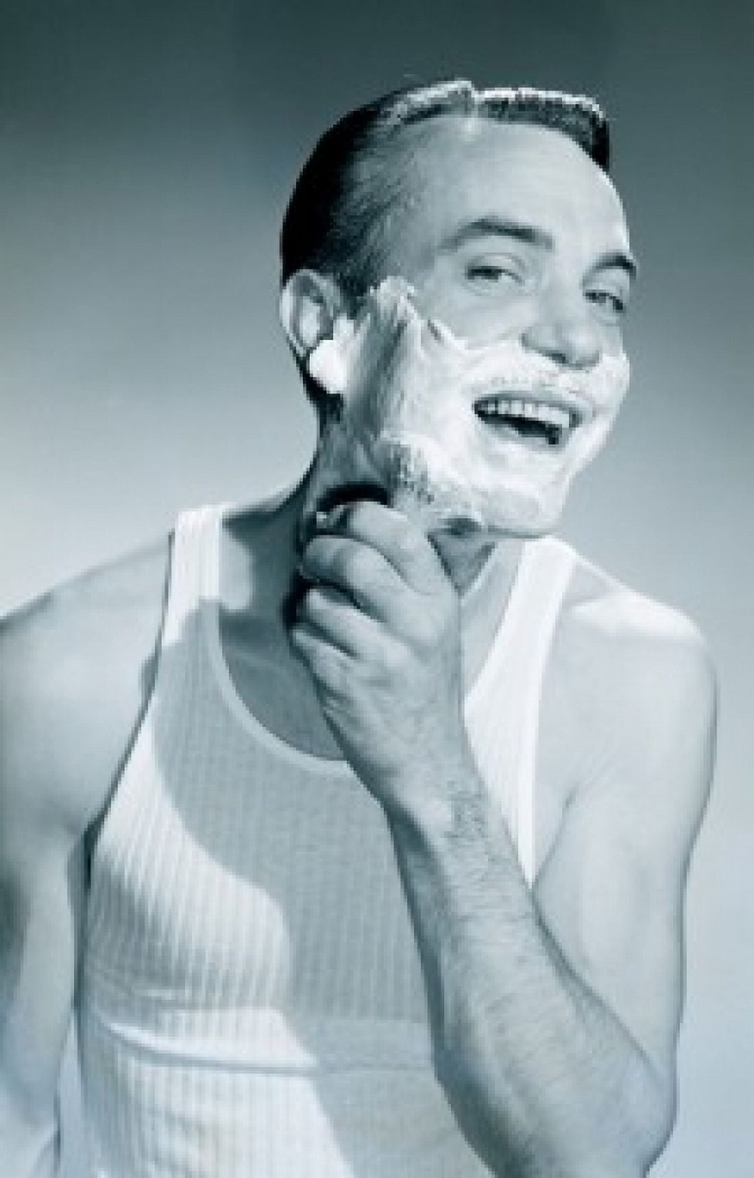 Studio portrait of man applying shaving cream Canvas Art - (18 x 24)
