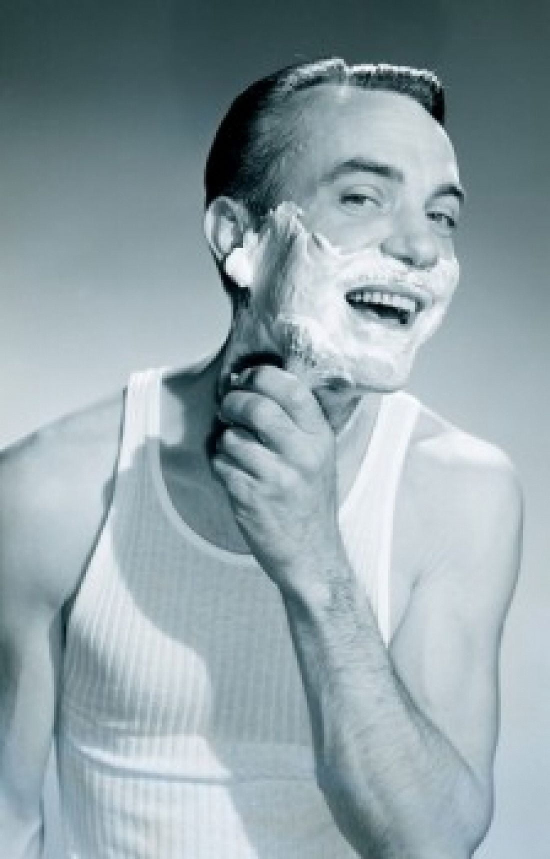 Studio portrait of man applying shaving cream Canvas Art - (24 x 36)