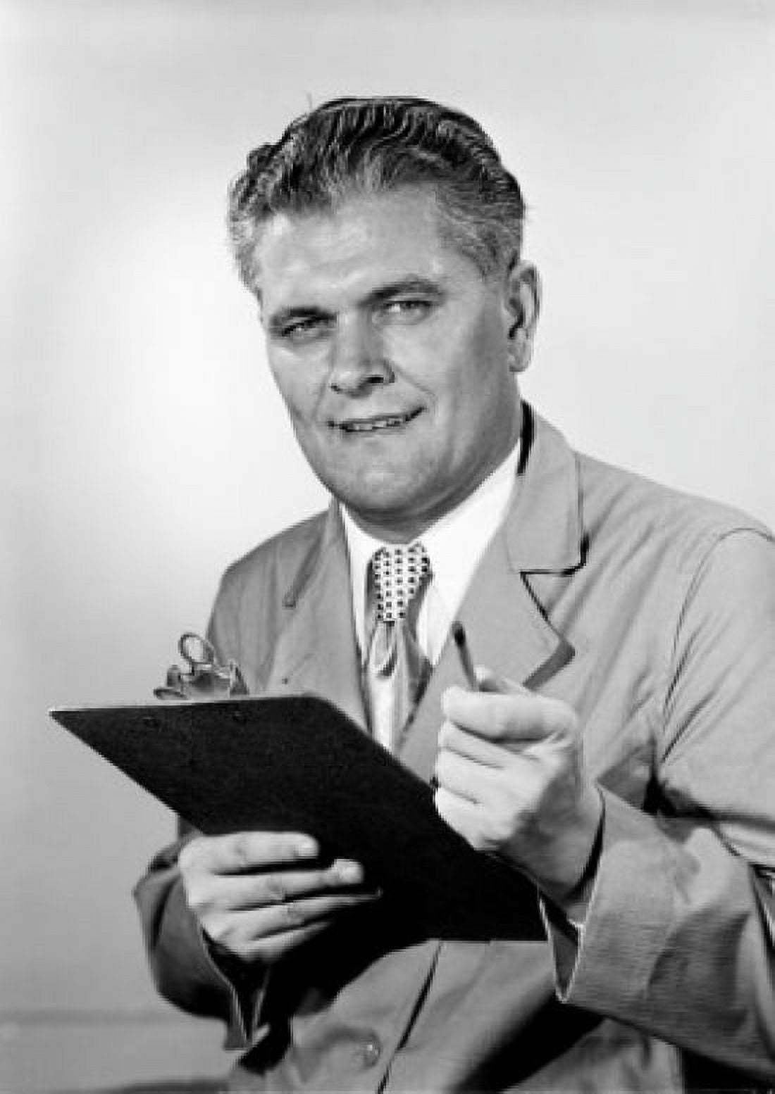 Studio portrait of man holding clipboard Canvas Art - (24 x 36)