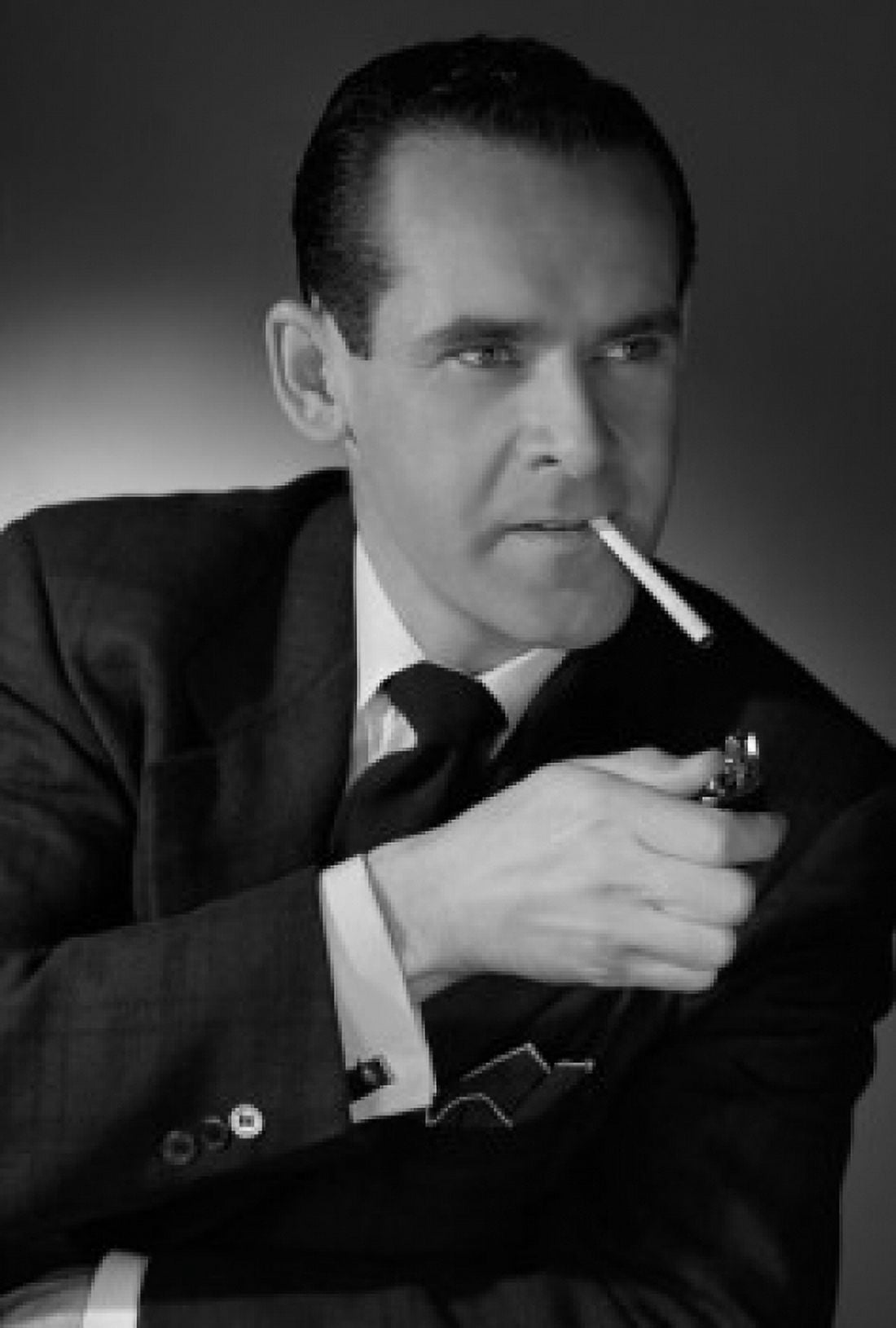 Studio portrait of man igniting cigarette with cigarette lighter Canvas Art - (24 x 36)