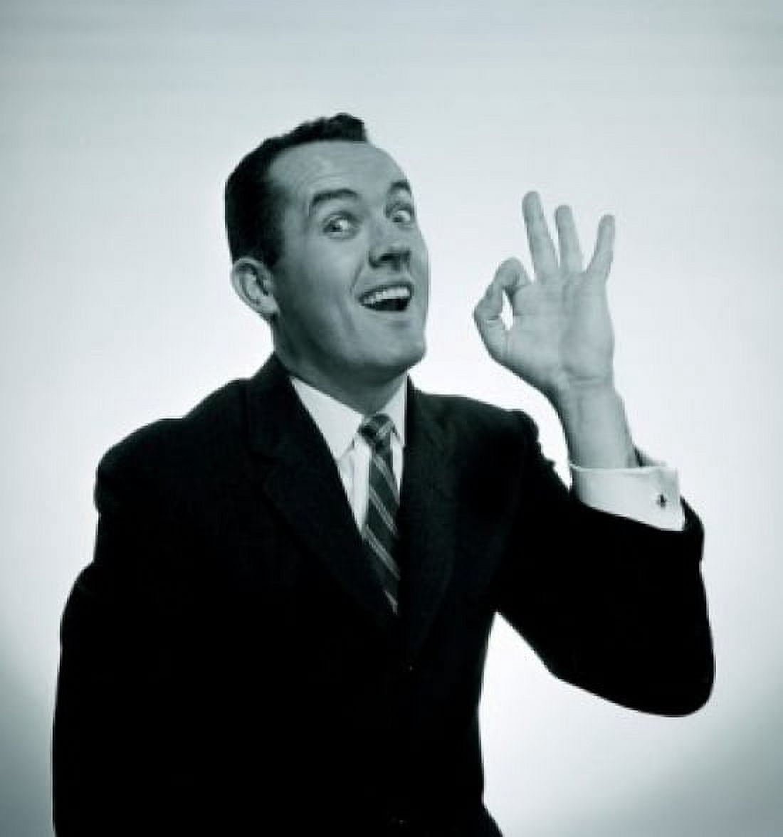 Studio portrait of man showing OK hand sign Canvas Art - (24 x 36)