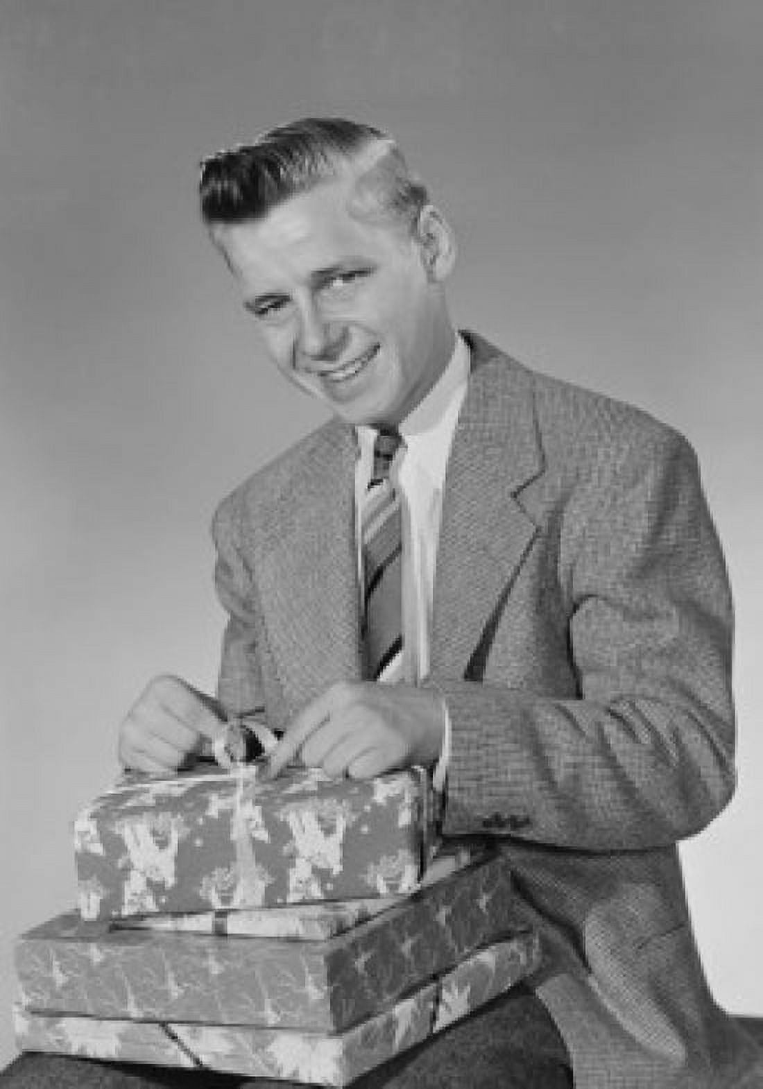 Studio portrait of man with stack of Christmas gifts Canvas Art - (18 x 24)