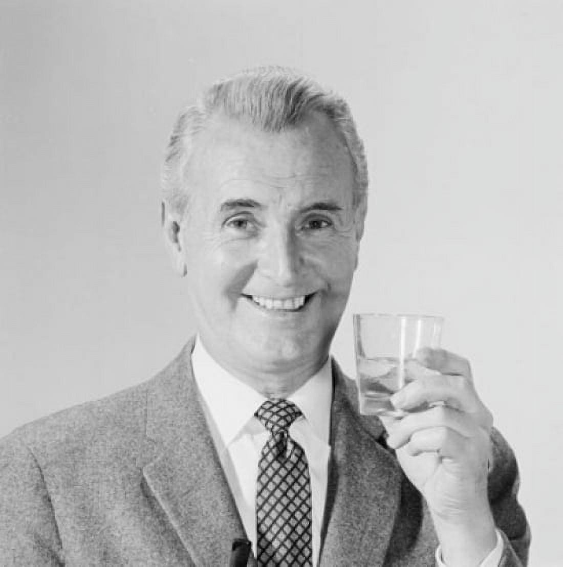 Studio portrait of mature man holding drink Canvas Art - (24 x 36)