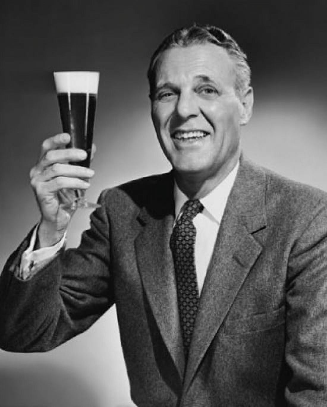Studio portrait of mature man holding glass of beer Canvas Art - (18 x 24)