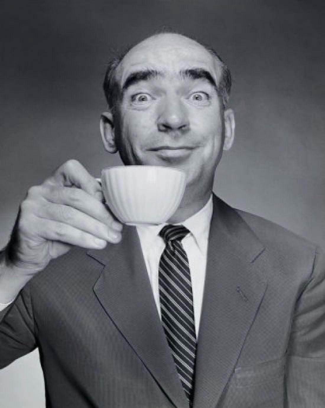 Studio portrait of mid adult man holding tea cup Canvas Art - (24 x 36)