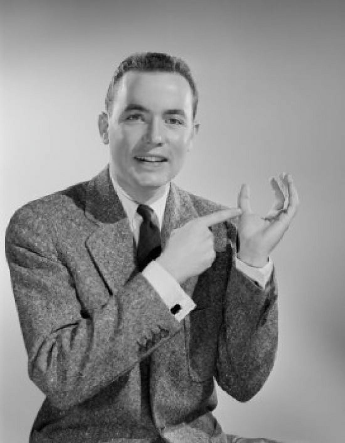 Studio portrait of mid adult man showing thumb Canvas Art - (24 x 36)