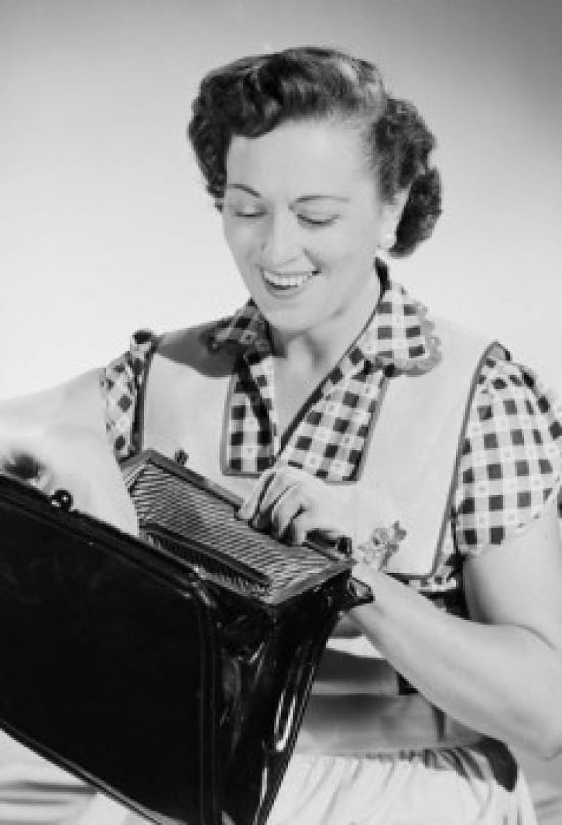 Studio portrait of mid adult woman opening purse Canvas Art - (24 x 36)