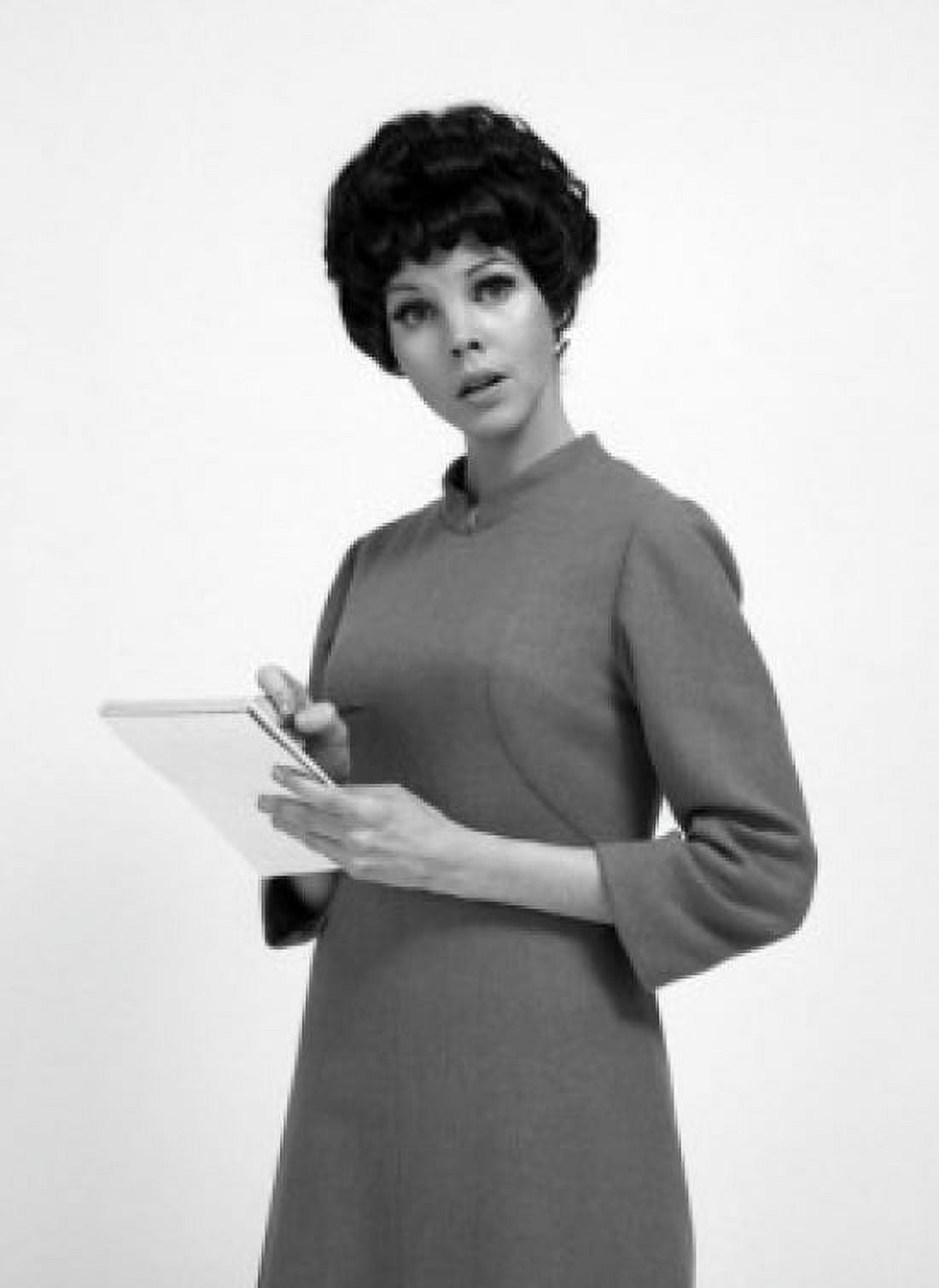 Studio portrait of secretary holding notepad Canvas Art - (18 x 24)