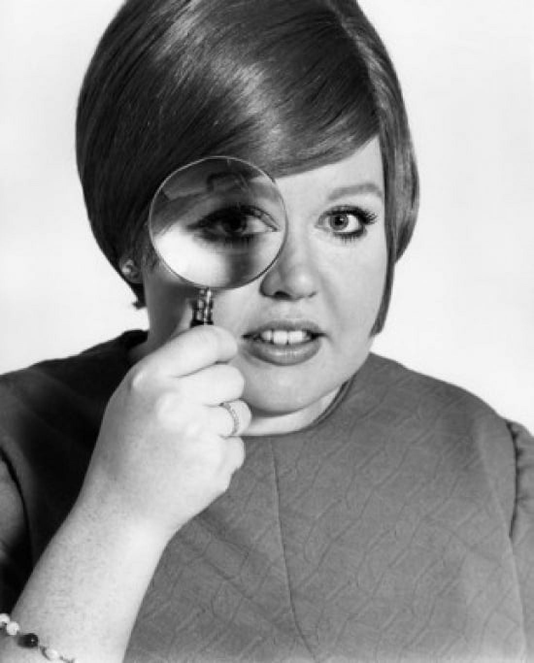 Studio portrait of teenage girl looking through magnifying glass Canvas Art - (18 x 24)