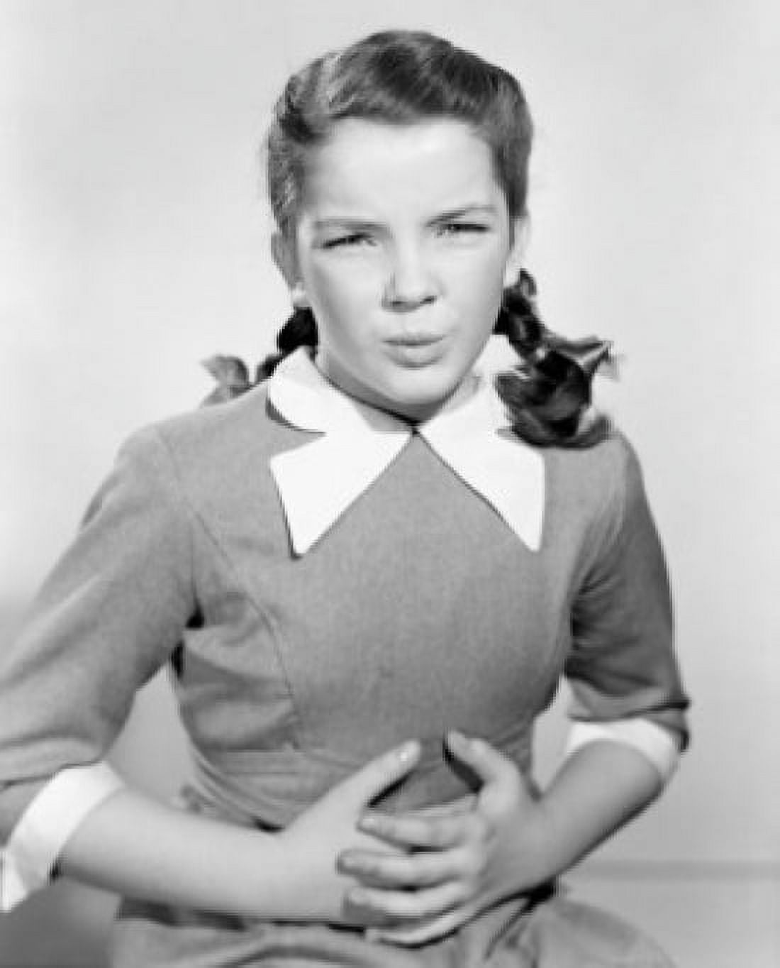 Studio portrait of teenage girl with hands on stomach Canvas Art - (18 x 24)