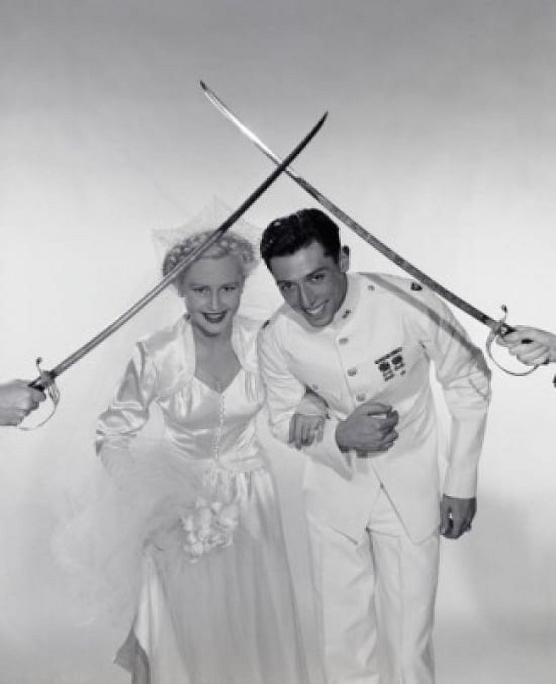 Studio portrait of wedding couple moving beneath crossed swords Canvas Art - (18 x 24)