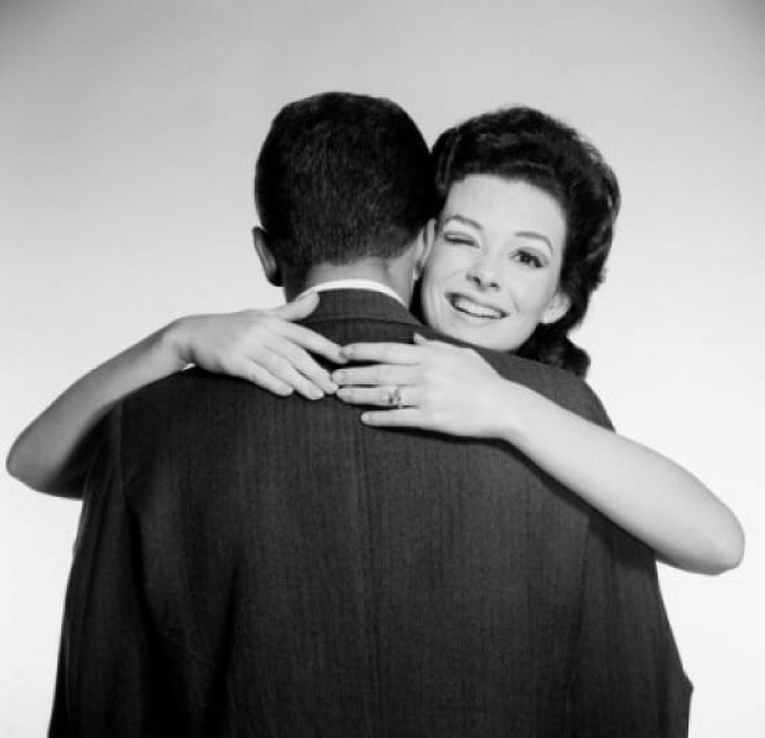 Studio portrait of woman embracing husband Canvas Art - (18 x 24)