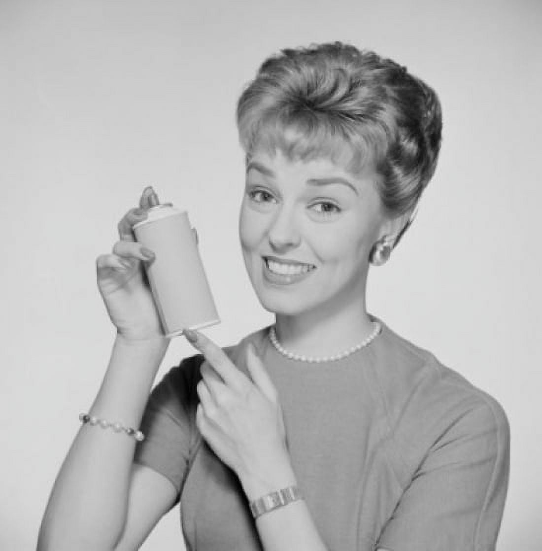 Studio portrait of woman holding spray bottle Canvas Art - (18 x 24)
