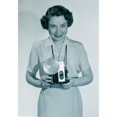 thumbnail image 1 of Studio portrait of woman holding video camera Poster Print (24 x 36), 1 of 4
