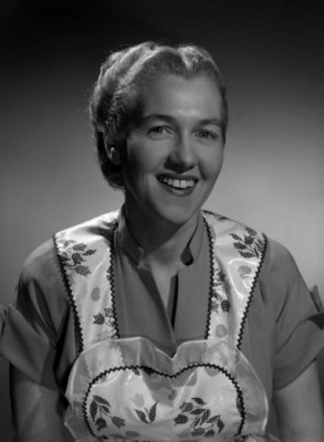 Studio portrait of woman wearing apron smiling Canvas Art - (24 x 36)