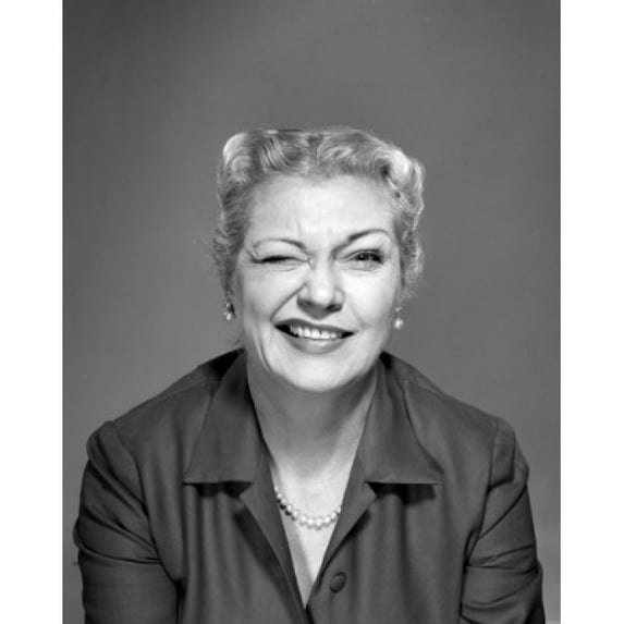 Studio portrait of woman winking Poster Print (24 x 36)