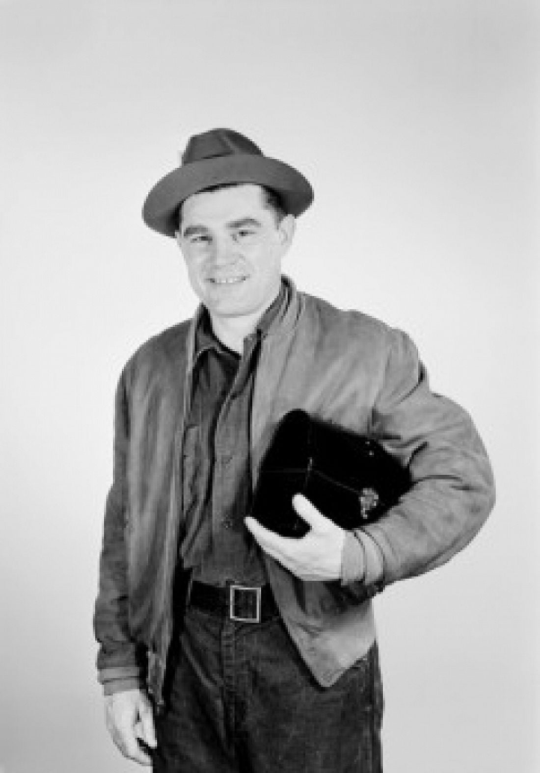 Studio portrait of worker carrying lunchbox Canvas Art - (18 x 24)
