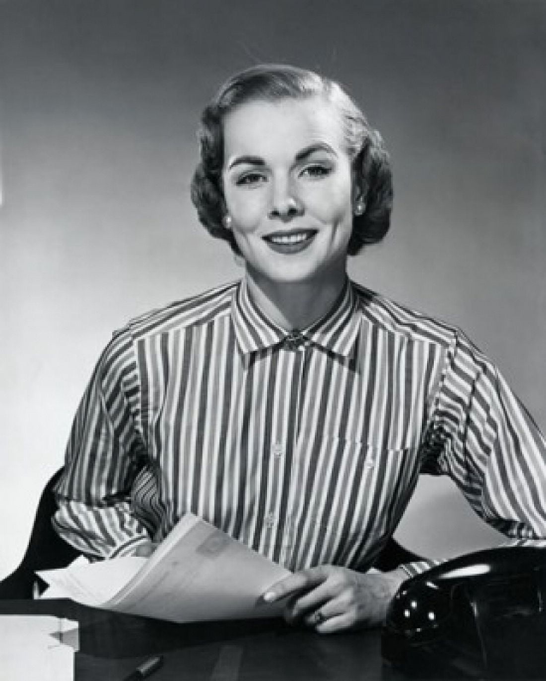 Studio portrait of young businesswoman holding papers Canvas Art - (18 x 24)