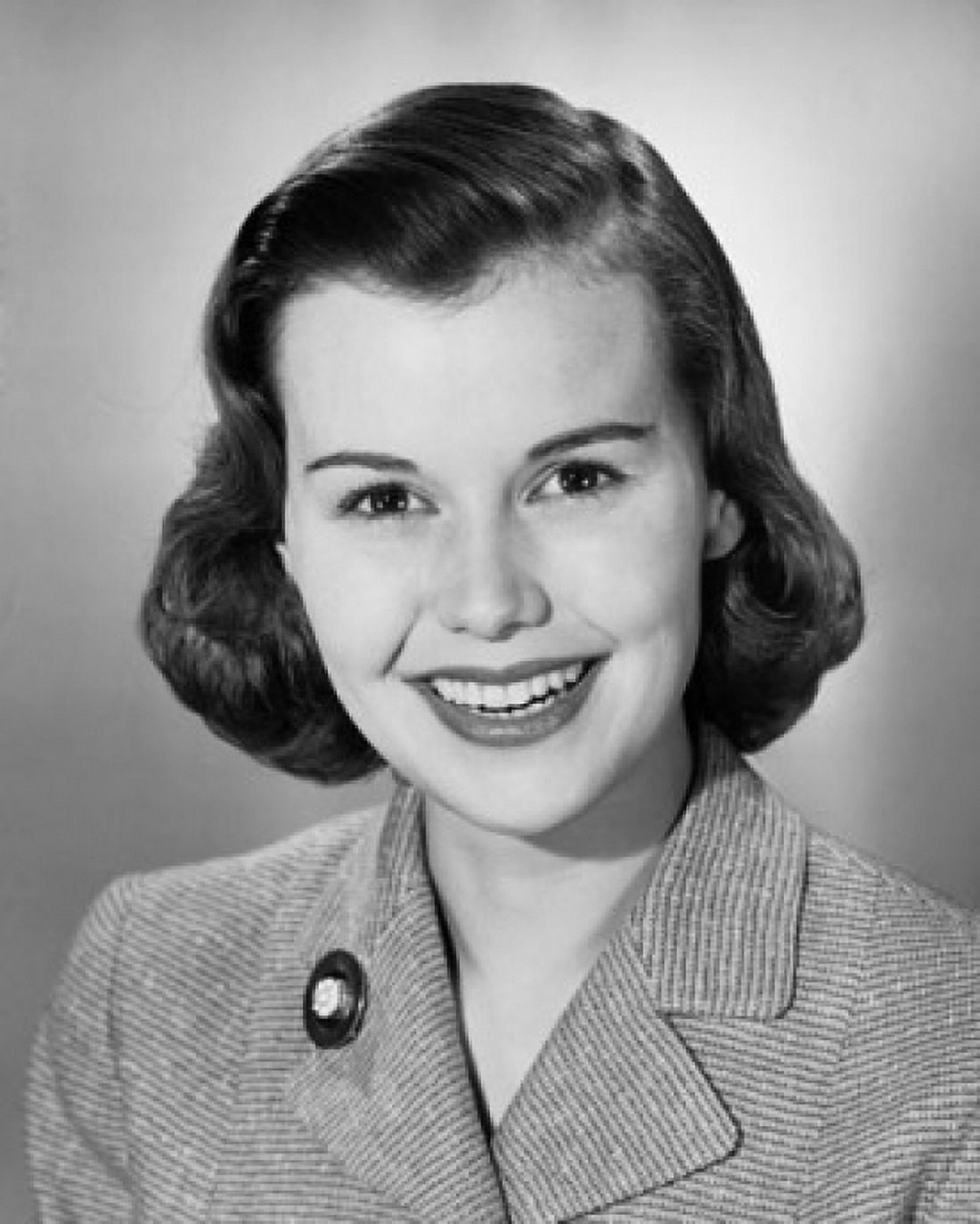 Studio portrait of young businesswoman with broach and gleaming smile Canvas Art - (18 x 24)