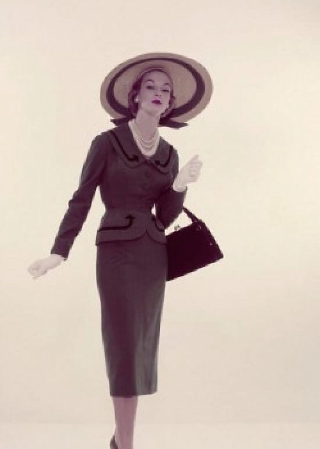 Studio portrait of young elegant woman carrying purse Canvas Art - (24 x 36)