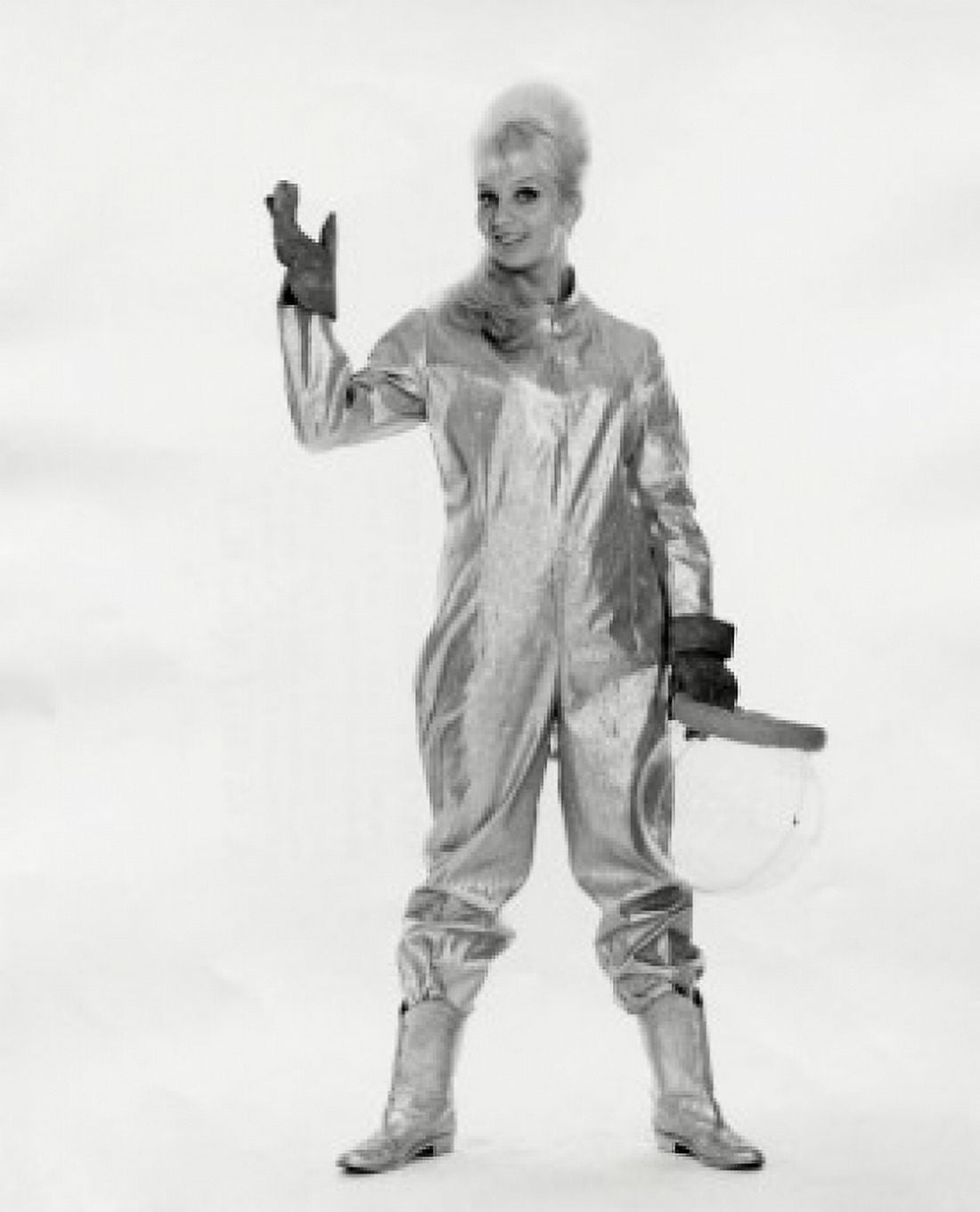 Studio portrait of young female astronaut holding space helmet Canvas Art - (18 x 24)
