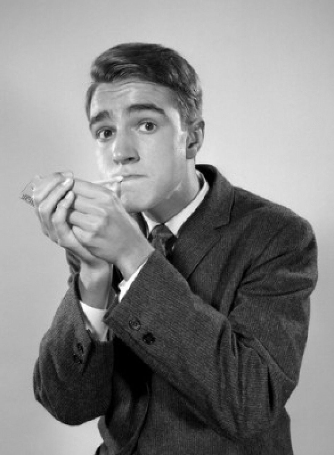 Studio portrait of young man igniting cigarette Canvas Art - (18 x 24)