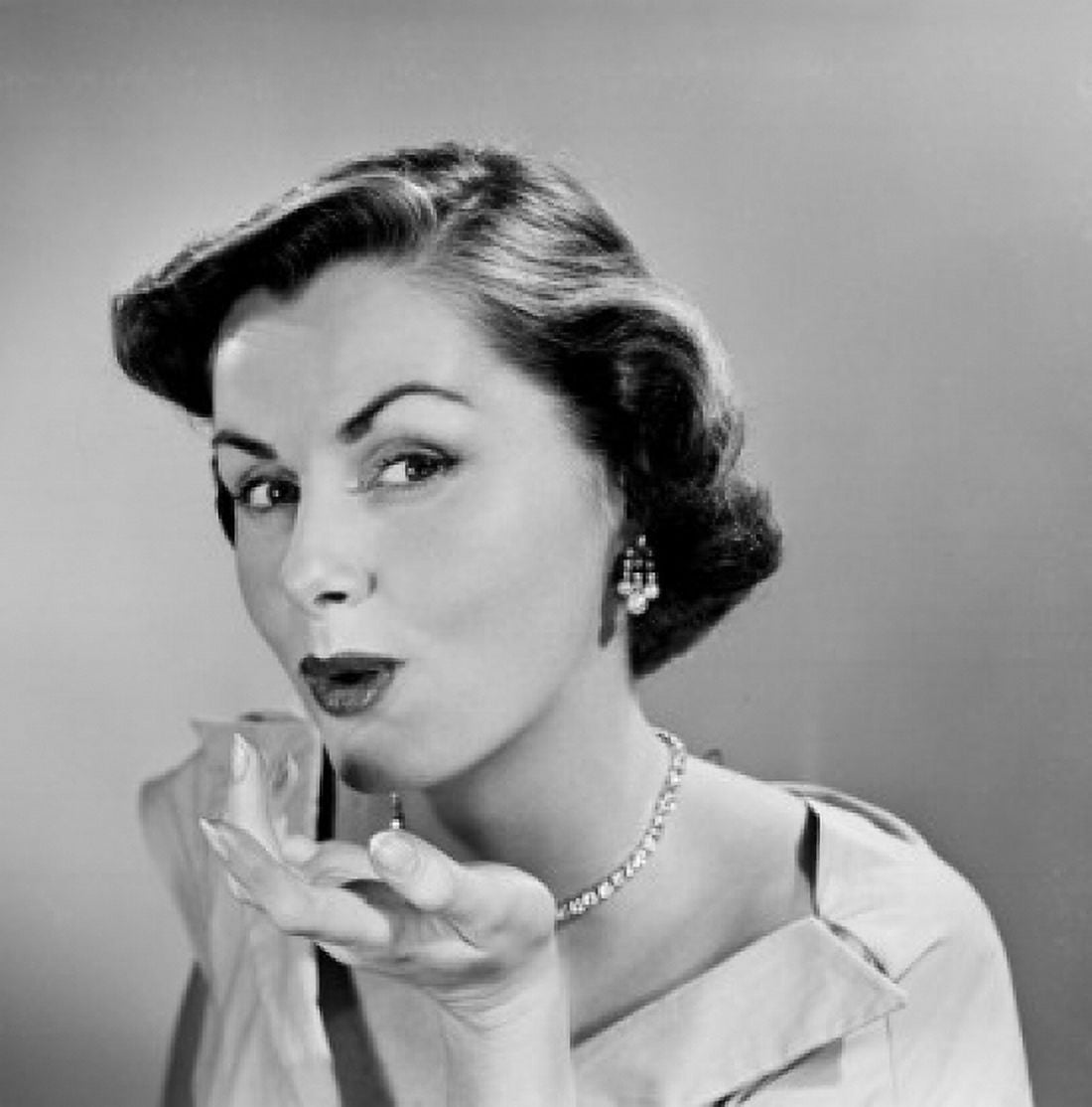 Studio portrait of young woman blowing kiss Canvas Art - (18 x 24)