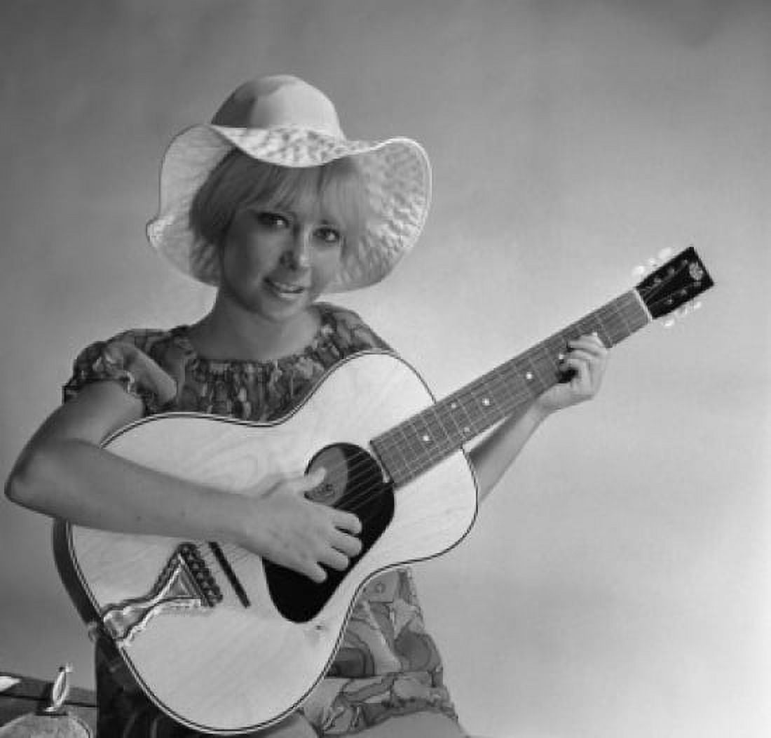 Studio portrait of young woman holding guitar Canvas Art - (18 x 24)