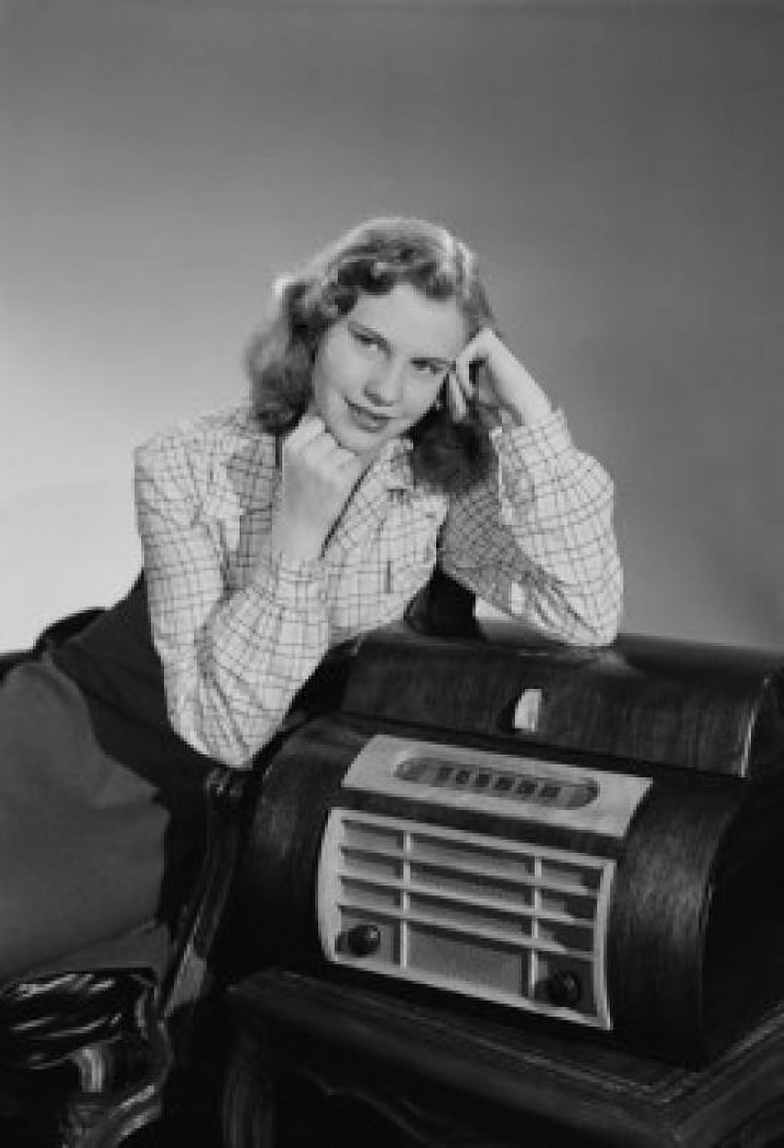 Studio portrait of young woman listening to radio Canvas Art - (24 x 36)