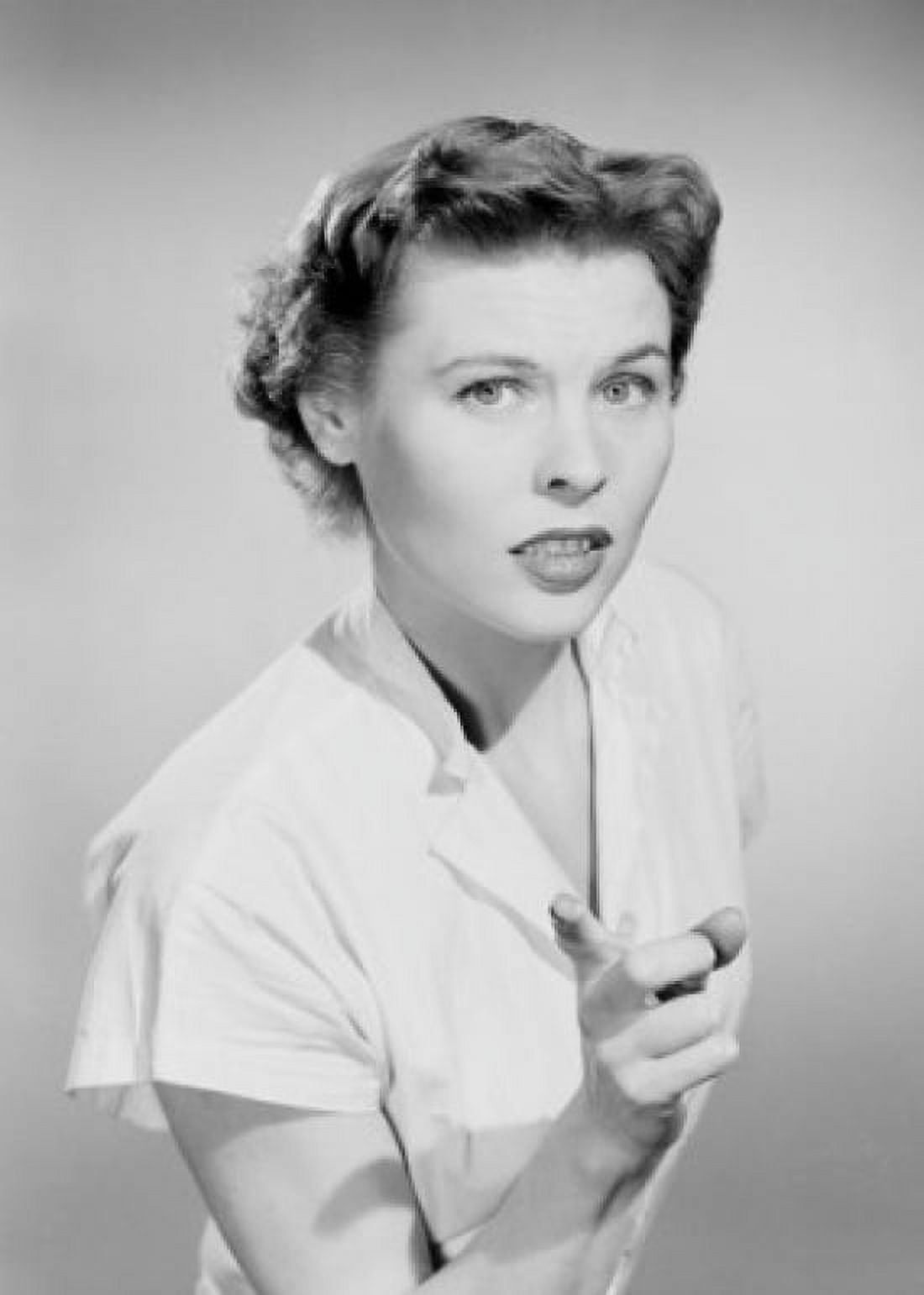 Studio portrait of young woman pointing Canvas Art - (18 x 24)