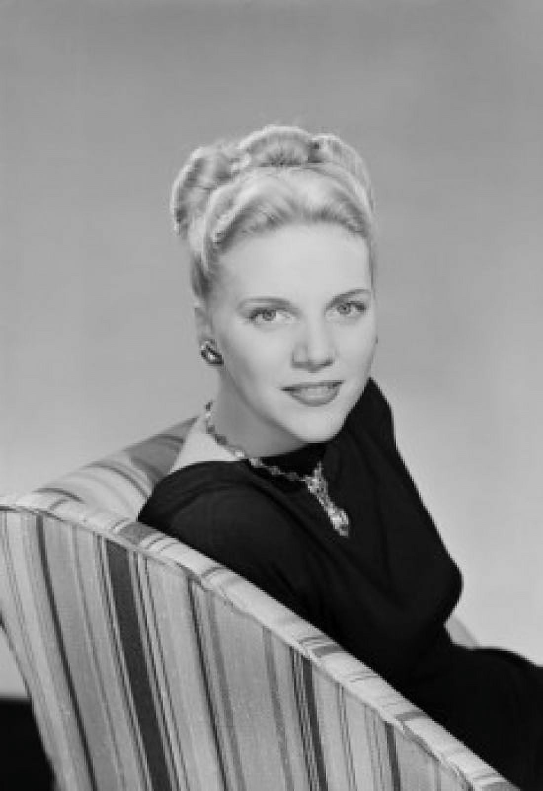 Studio portrait of young woman sitting in chair Canvas Art - (24 x 36)