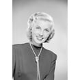 thumbnail image 1 of Studio portrait of young woman smiling Poster Print (24 x 36), 1 of 4