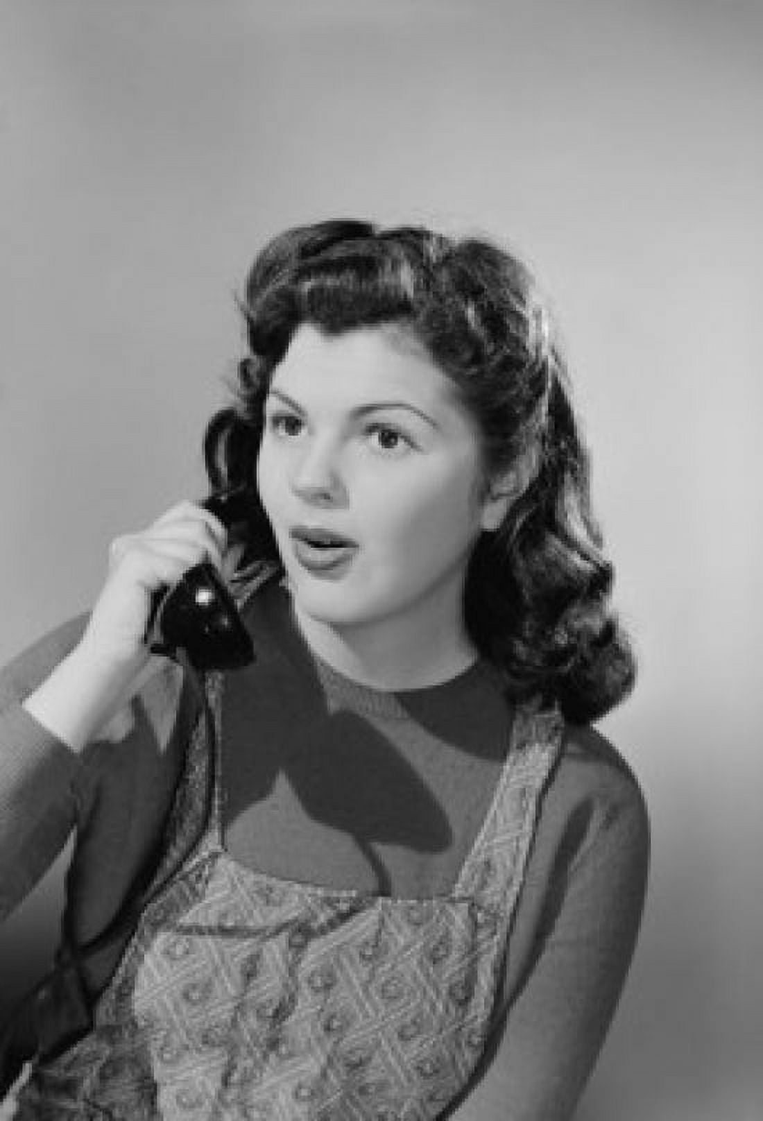 Studio portrait of young woman using telephone Canvas Art - (18 x 24)
