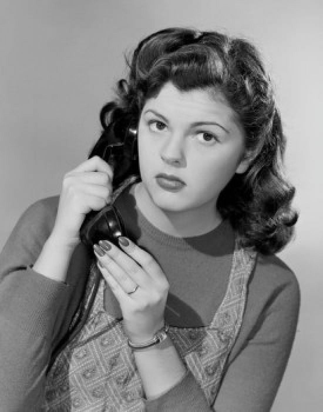 Studio portrait of young woman using telephone Canvas Art - (18 x 24)