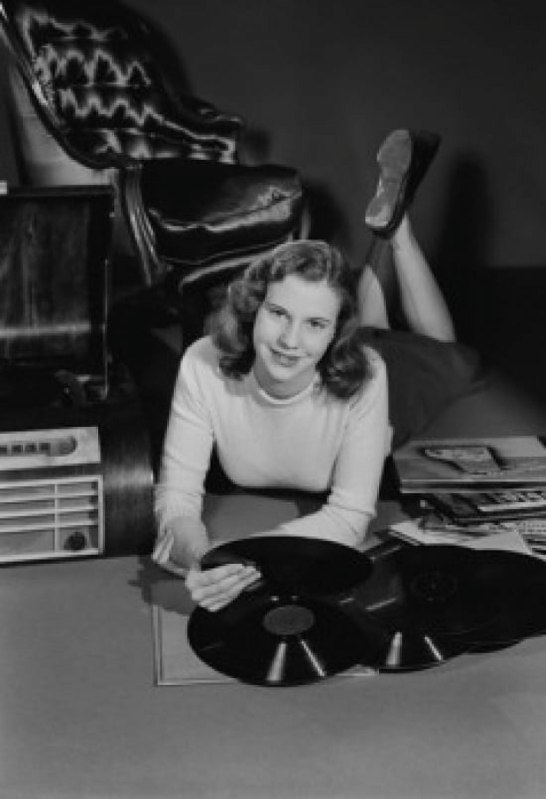 Studio portrait of young woman with records Canvas Art - (24 x 36)