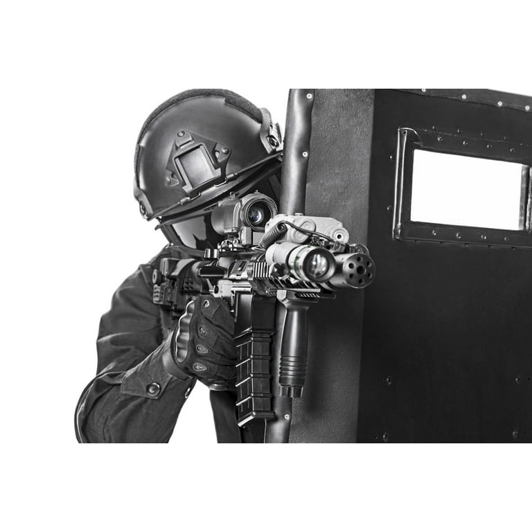 Studio shot of SWAT police special forces with pistol hiding