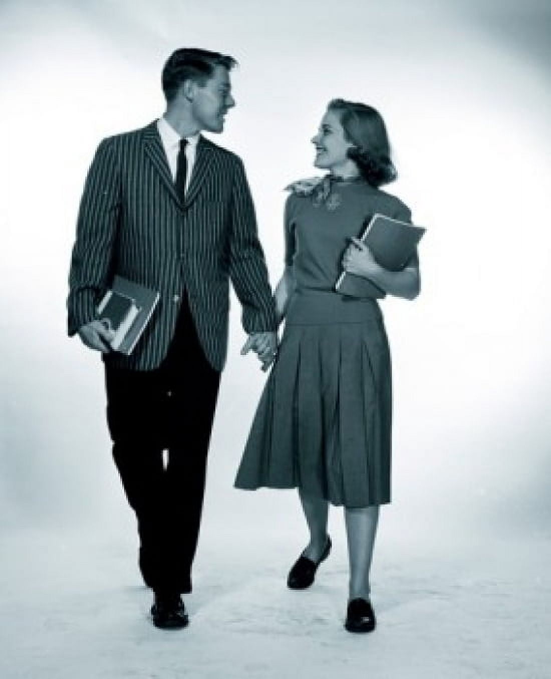 Studio shot of female and male students holding hands Canvas Art - (18 x 24)