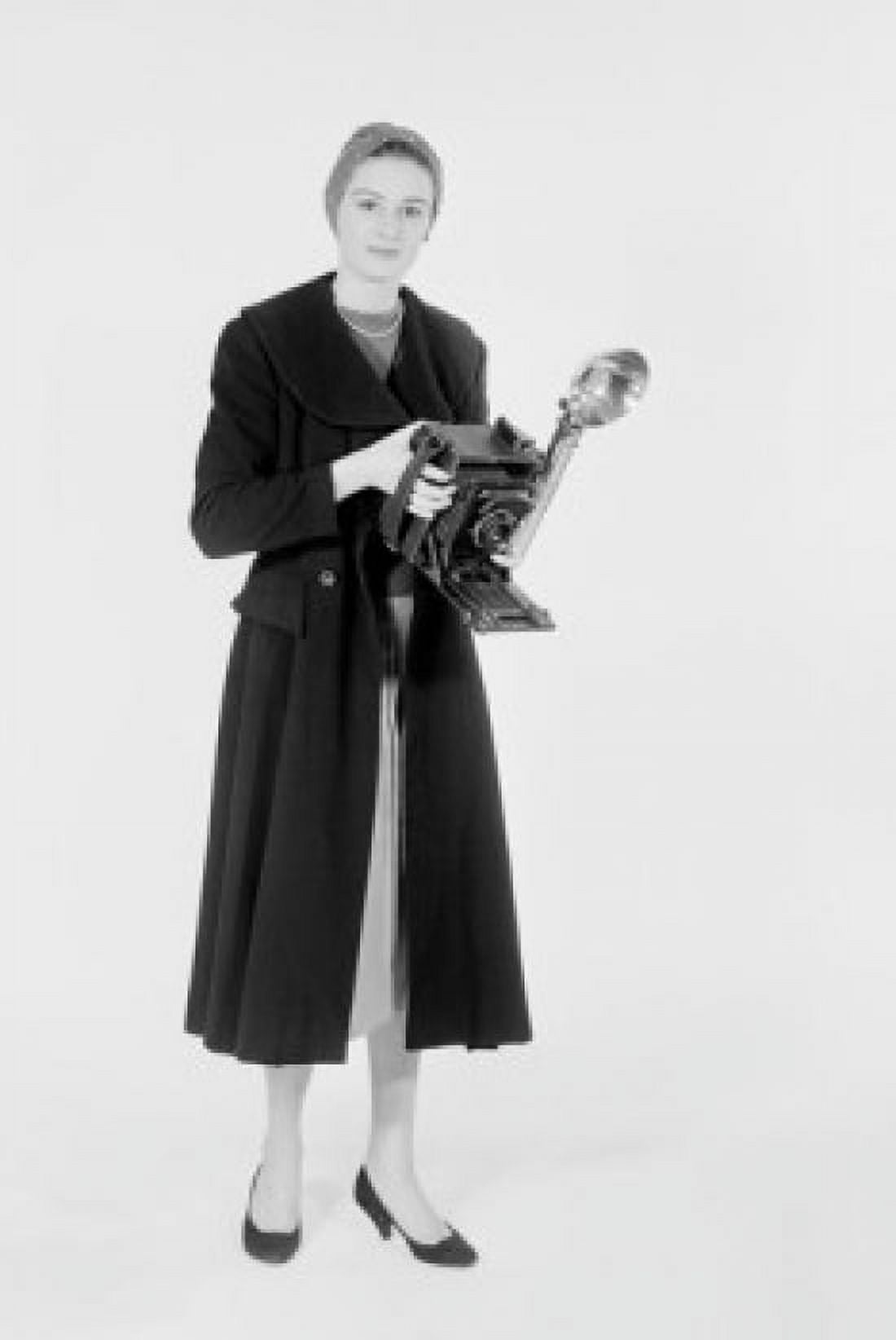 Studio shot of female photographer with camera Canvas Art - (24 x 36)