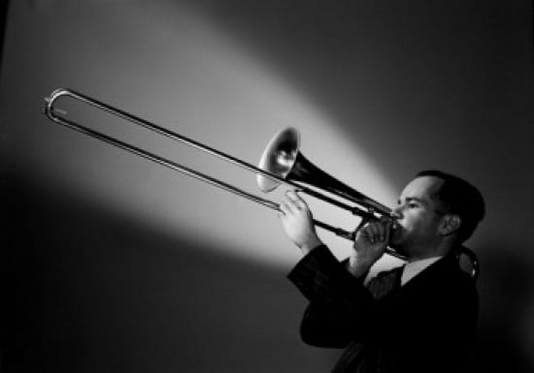 Studio shot of man playing trombone Canvas Art - (24 x 36)