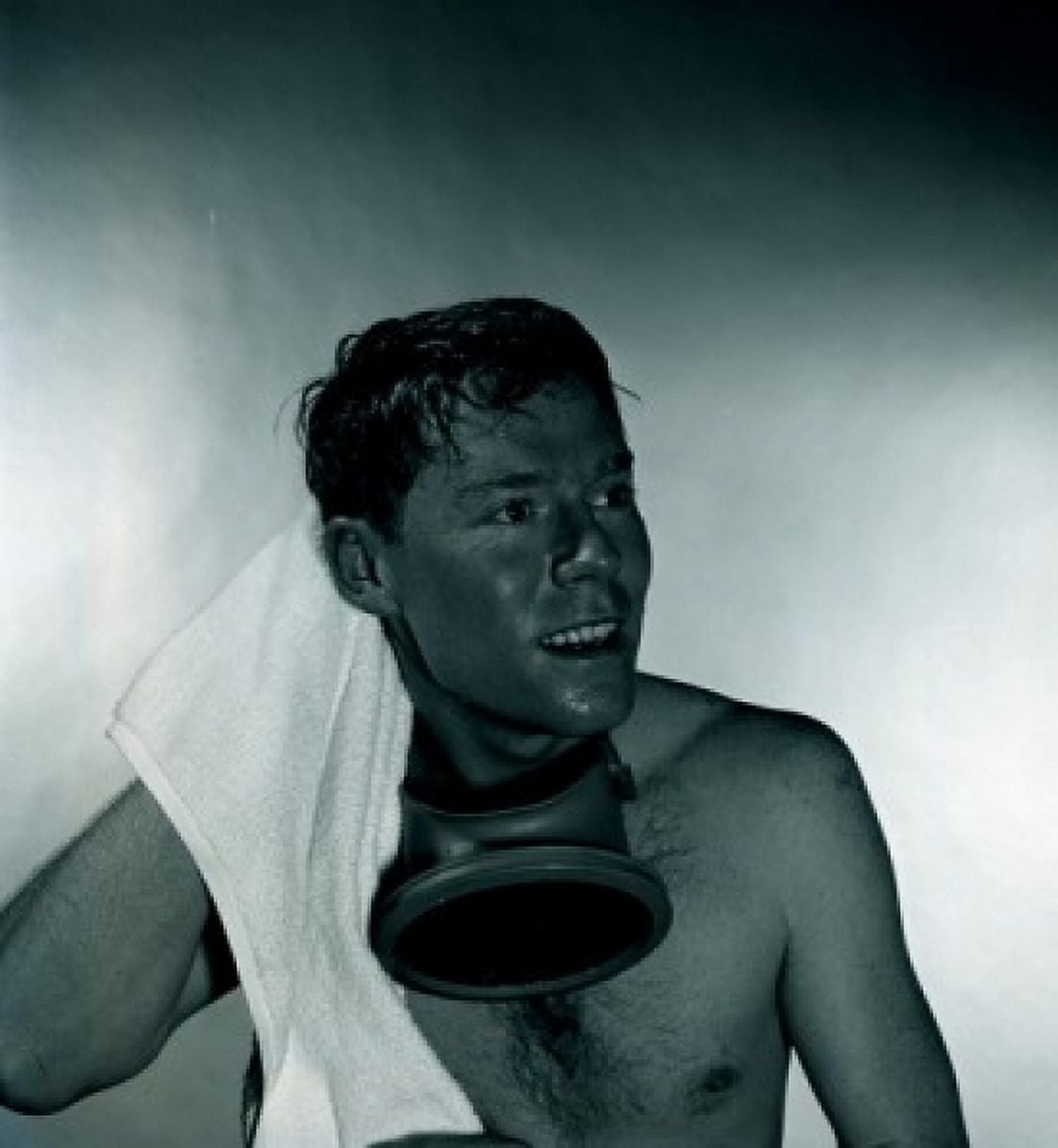 Studio shot of man with gas mask drying hair with towel Canvas Art -  (18 x 24)