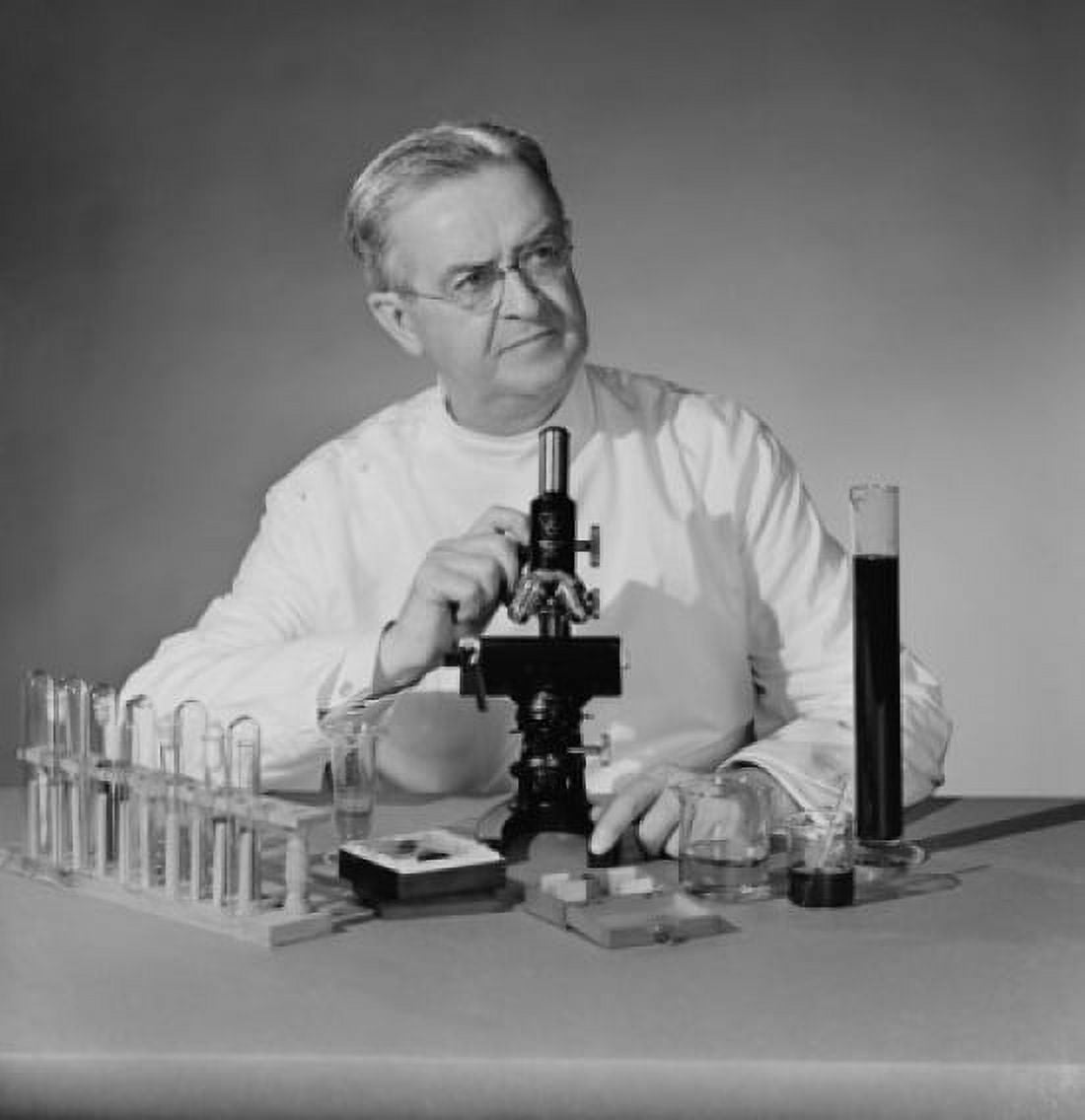 Studio shot of scientist with microscope and test tubes Canvas Art - (24 x 36)